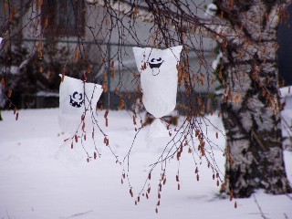 Halloween ghosts in trees in the Snow